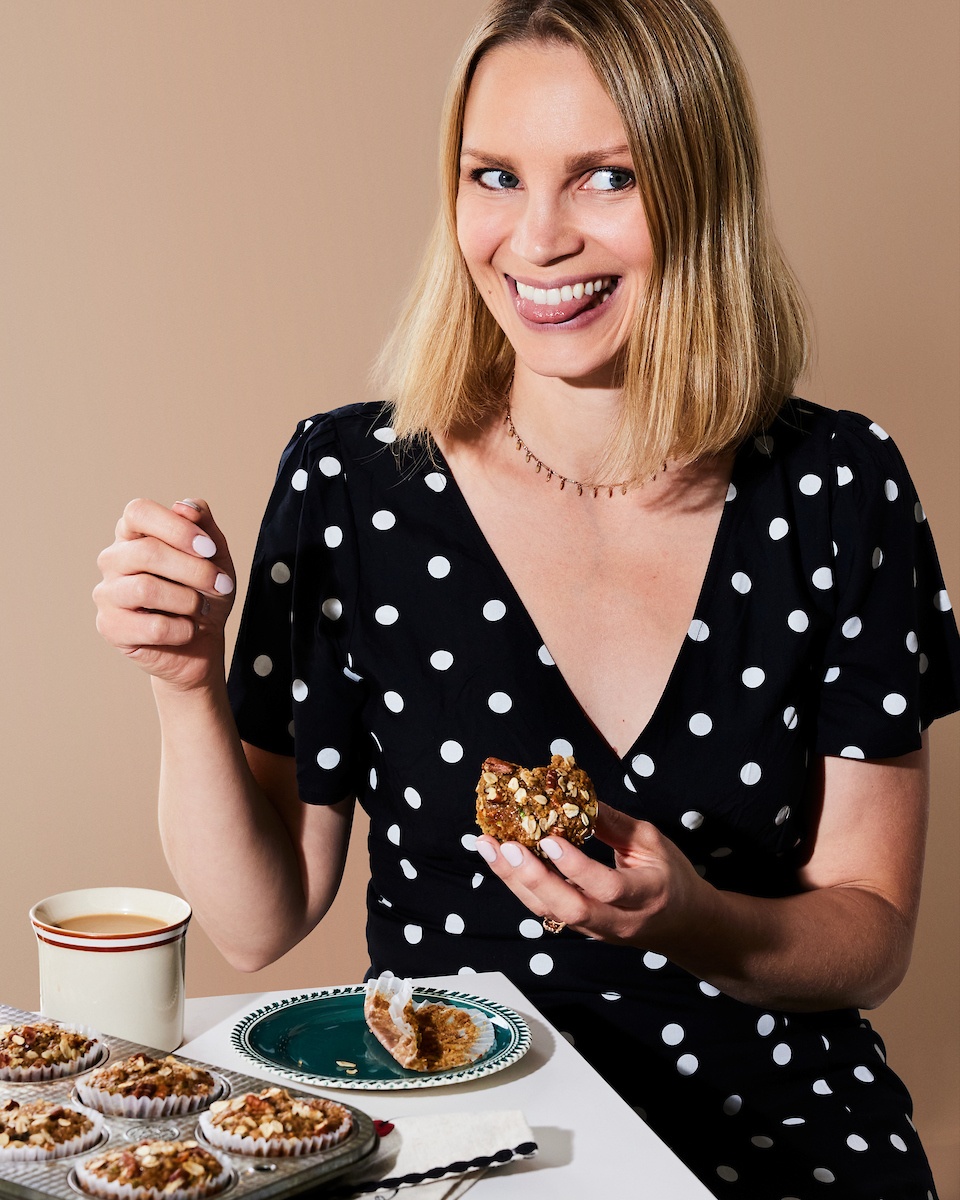 monique from ambitious kitchen holding a muffin