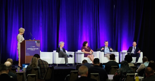 Speakers on stage at the AI Forum