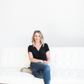 monique sitting on a white couch