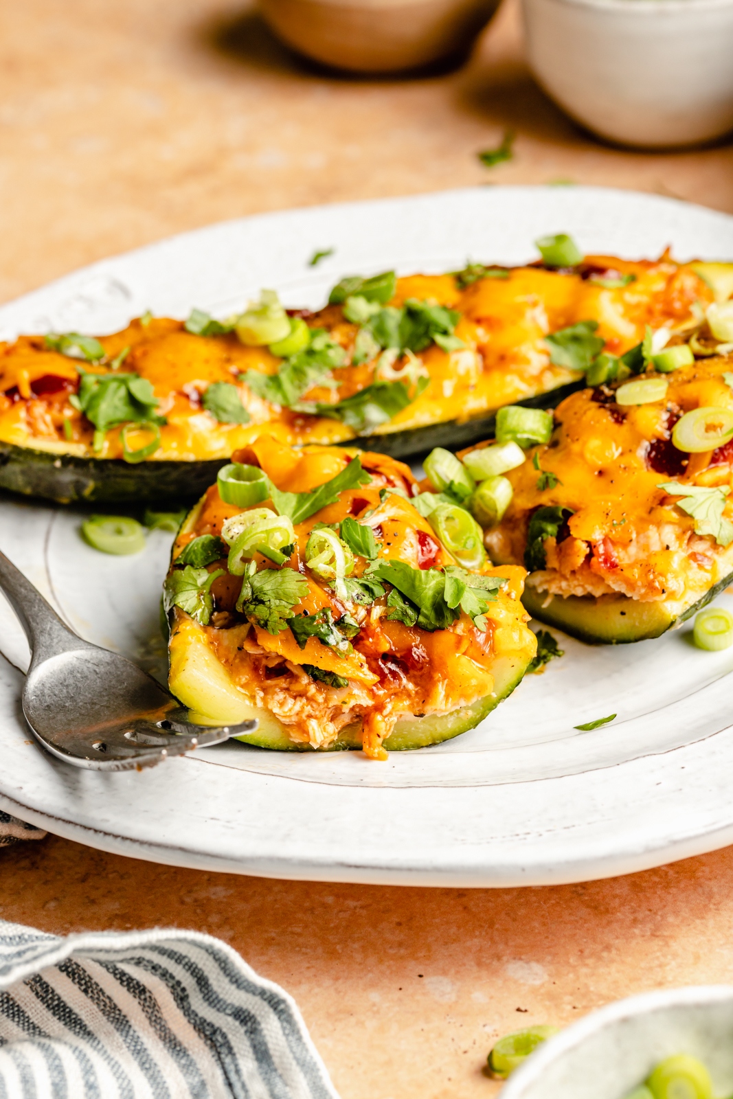 bbq chicken zucchini boat sliced on a plate