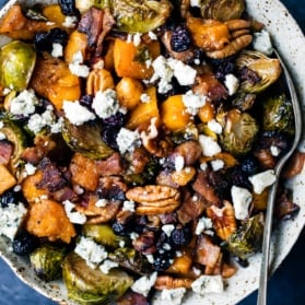 maple roasted butternut squash and brussels sprouts in a bowl