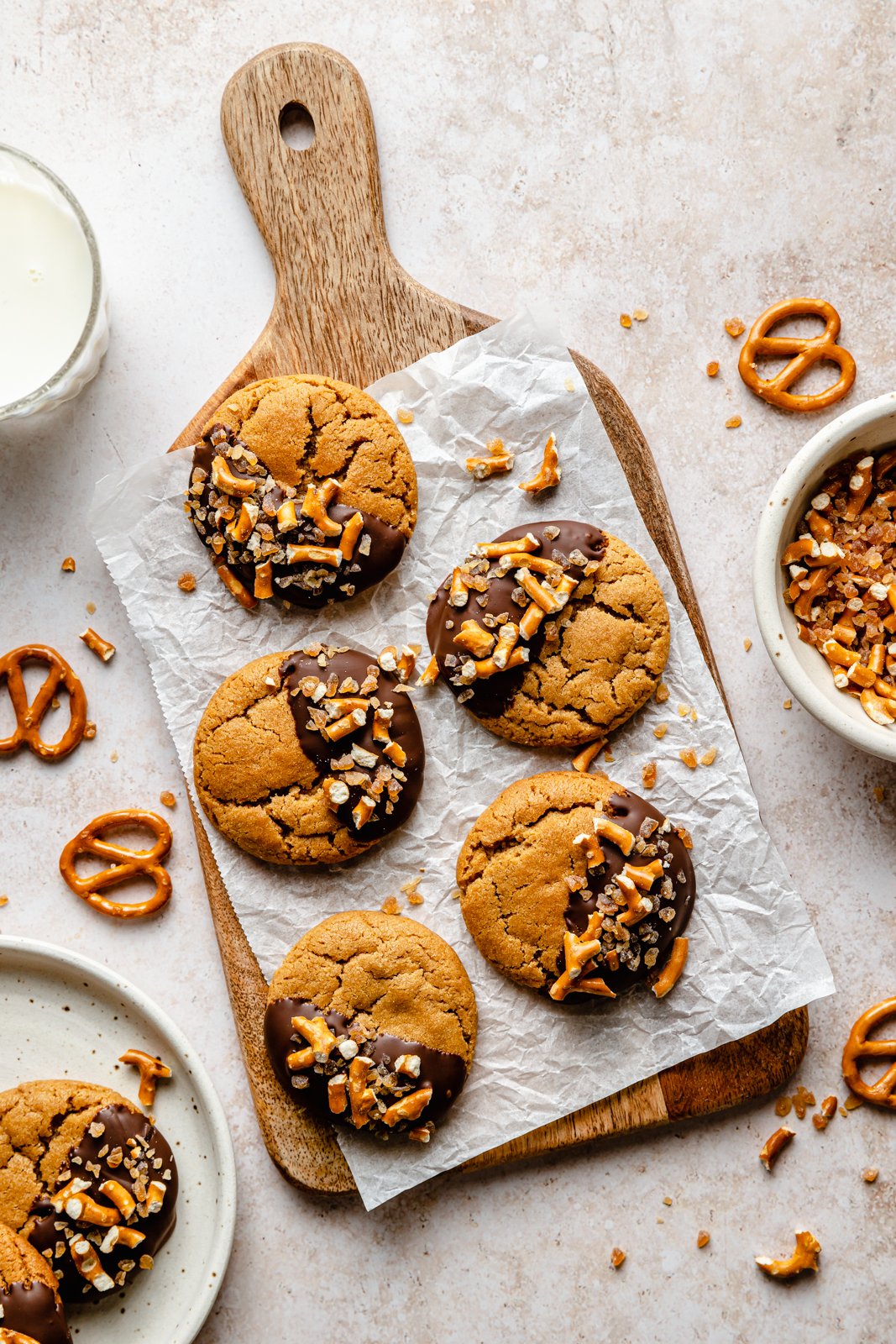 chocolate-dipped peanut butter cookies on a wooden board