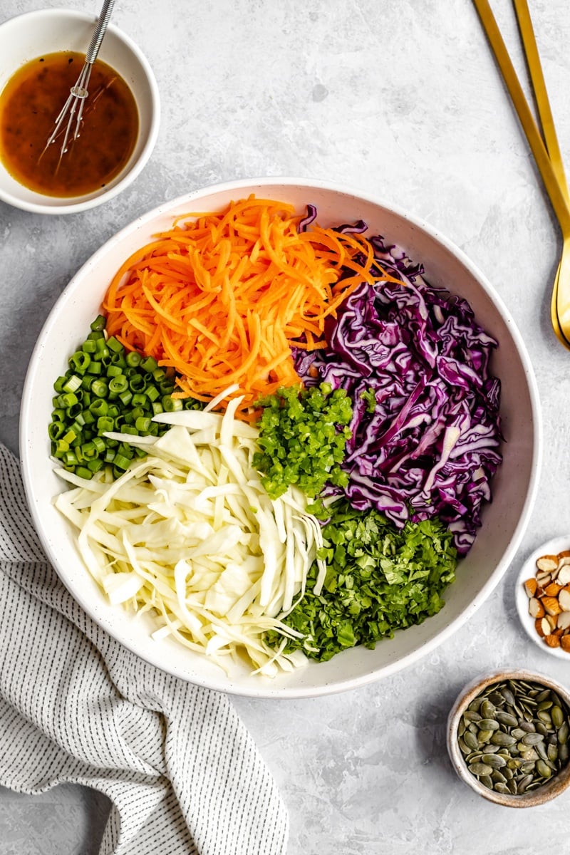 ingredients for coleslaw in a bowl before mixing