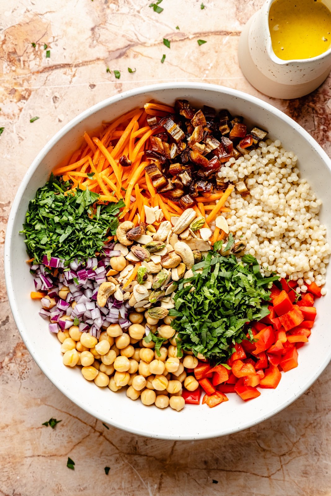 unmixed vegan curry couscous salad with vegetables in a bowl