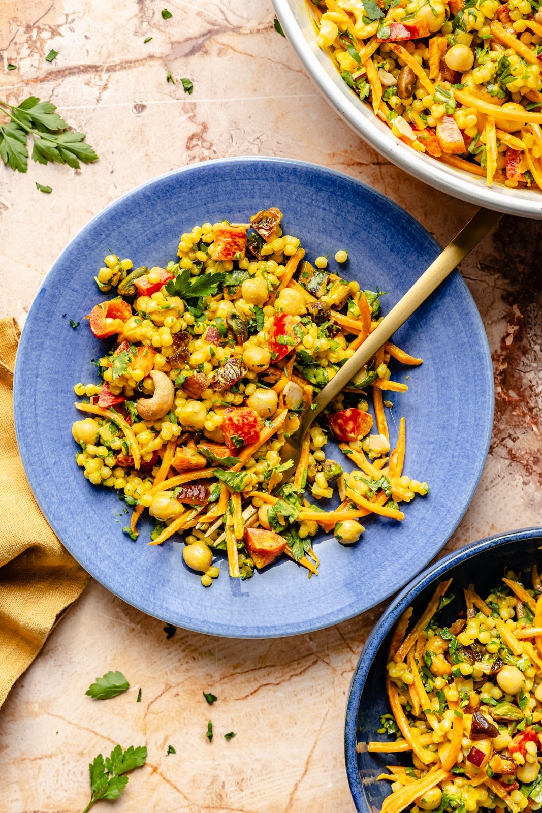 vegan curry couscous salad on a blue plate