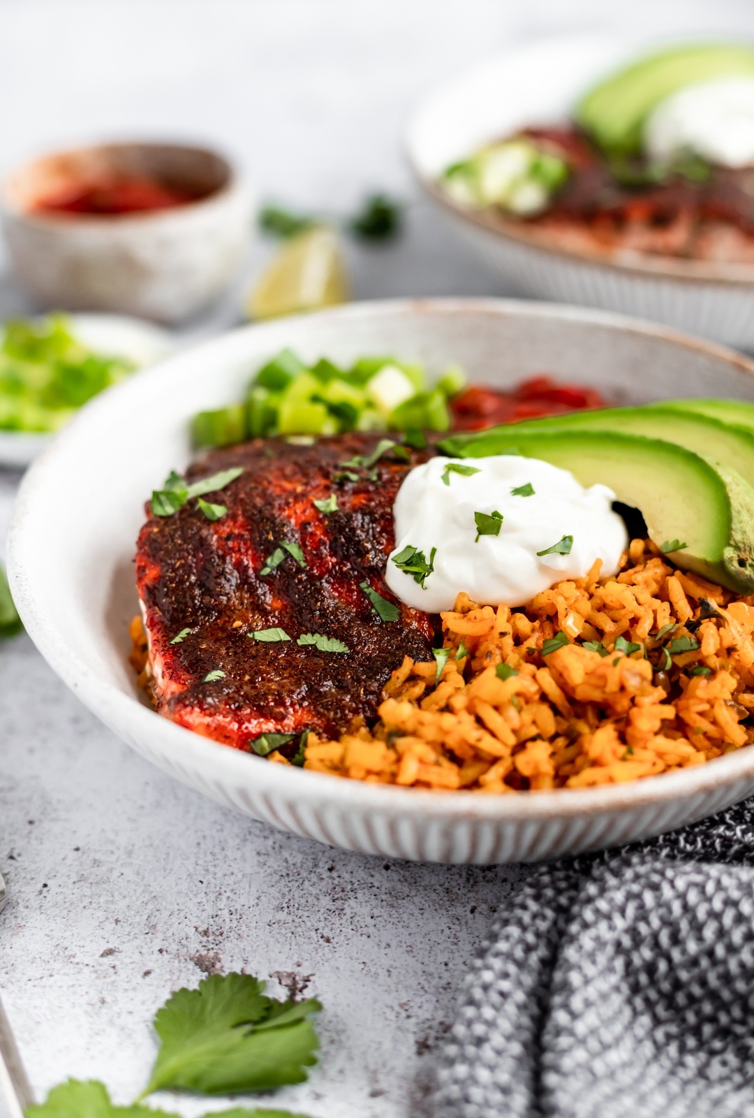 damn good salmon taco bowl topped with greek yogurt and avocado