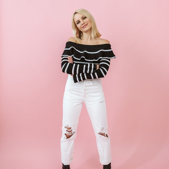 monique standing with a pink background