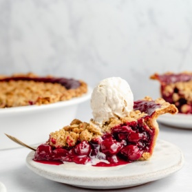 slice of tart cherry pie topped with ice cream