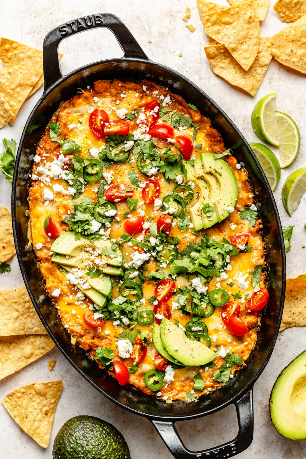 cheesy southwest bean dip in a skillet next to tortilla chips