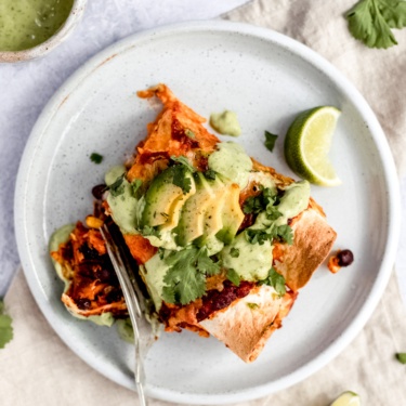 vegetarian sweet potato black bean enchiladas on a plate