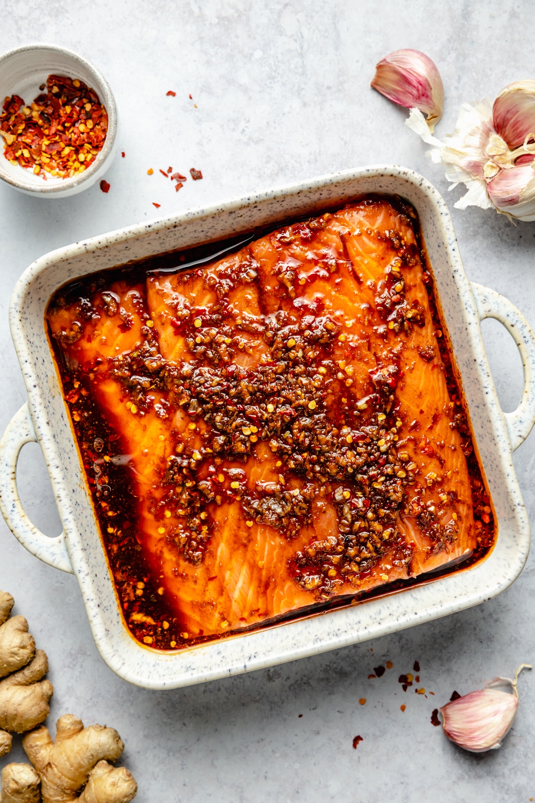 firecracker salmon marinating in a dish