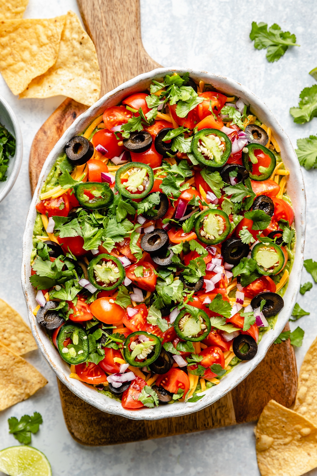 healthy 7 layer dip in a serving bowl