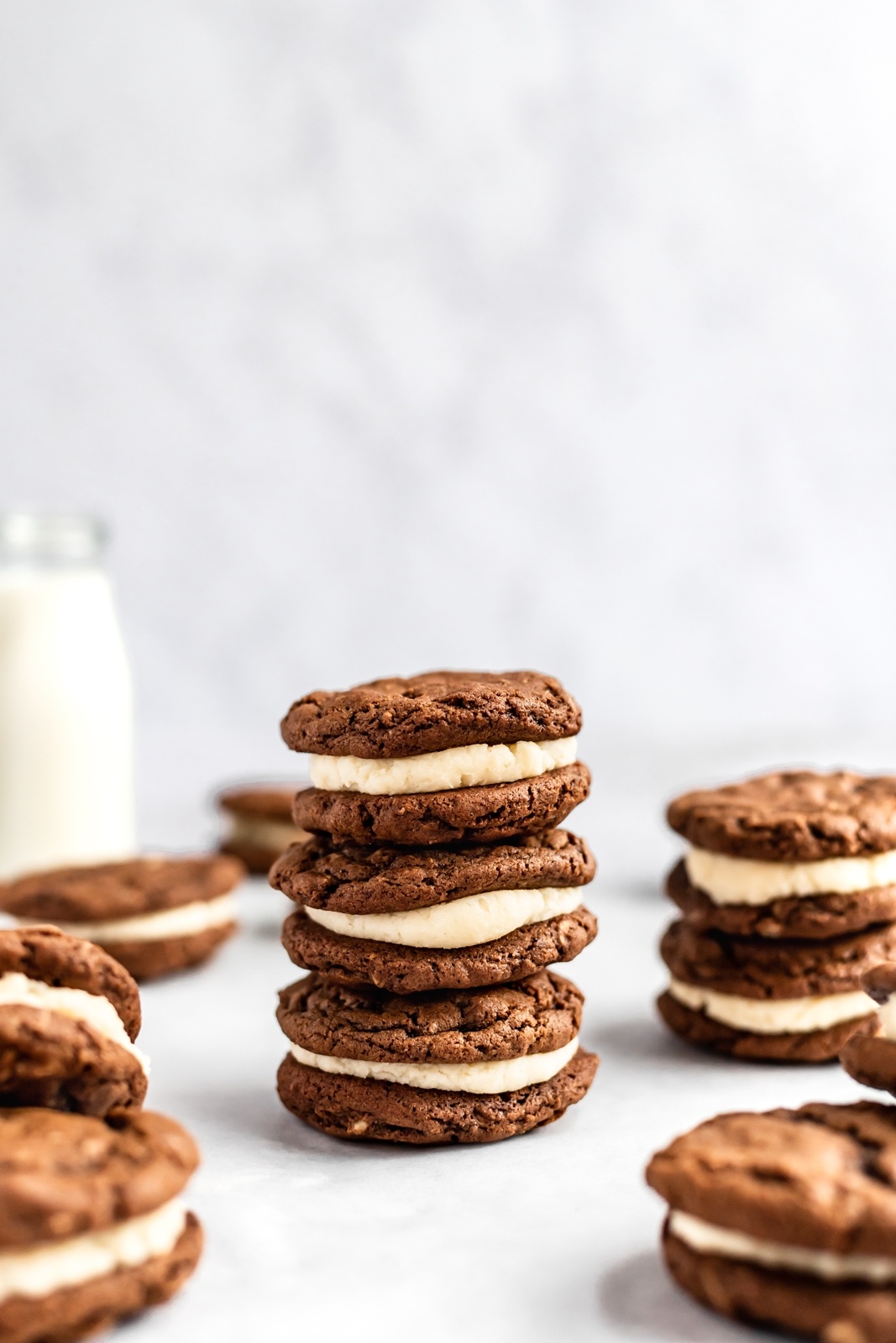 gingerbread sandwich cookies stacked on top of eachother