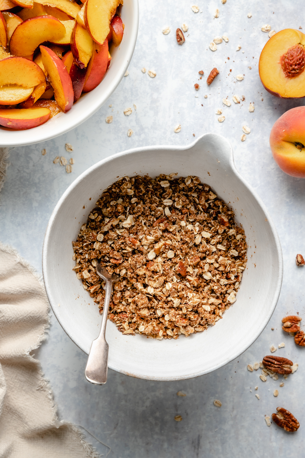 making a crumble in a bowl for gluten free peach crisp