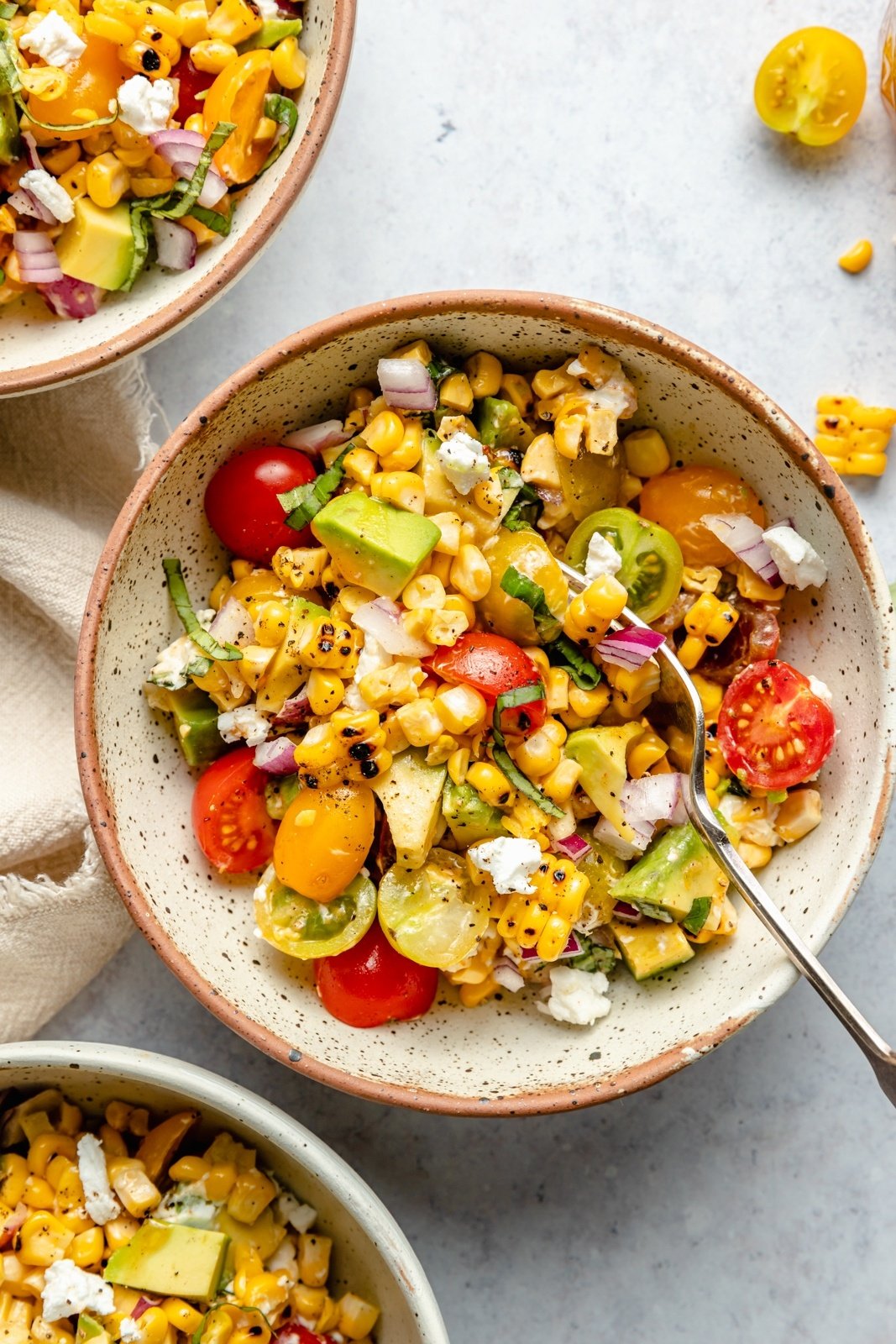 grilled corn salad with avocado in a bowl