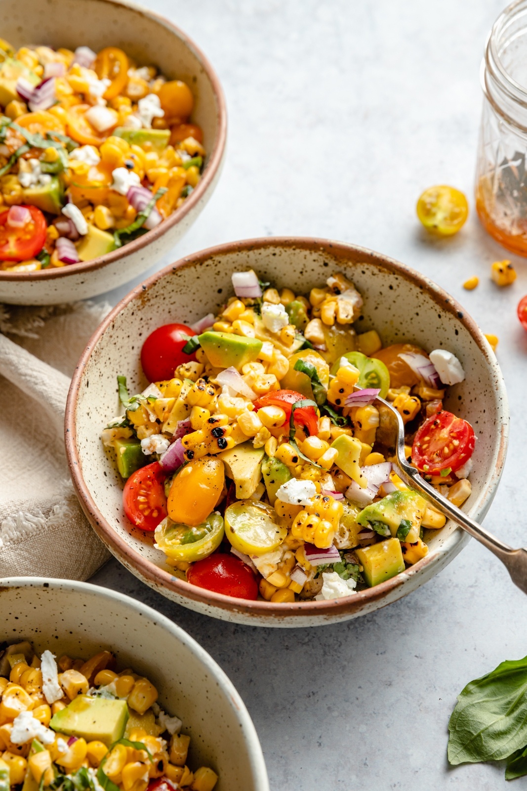 grilled corn salad in three bowls