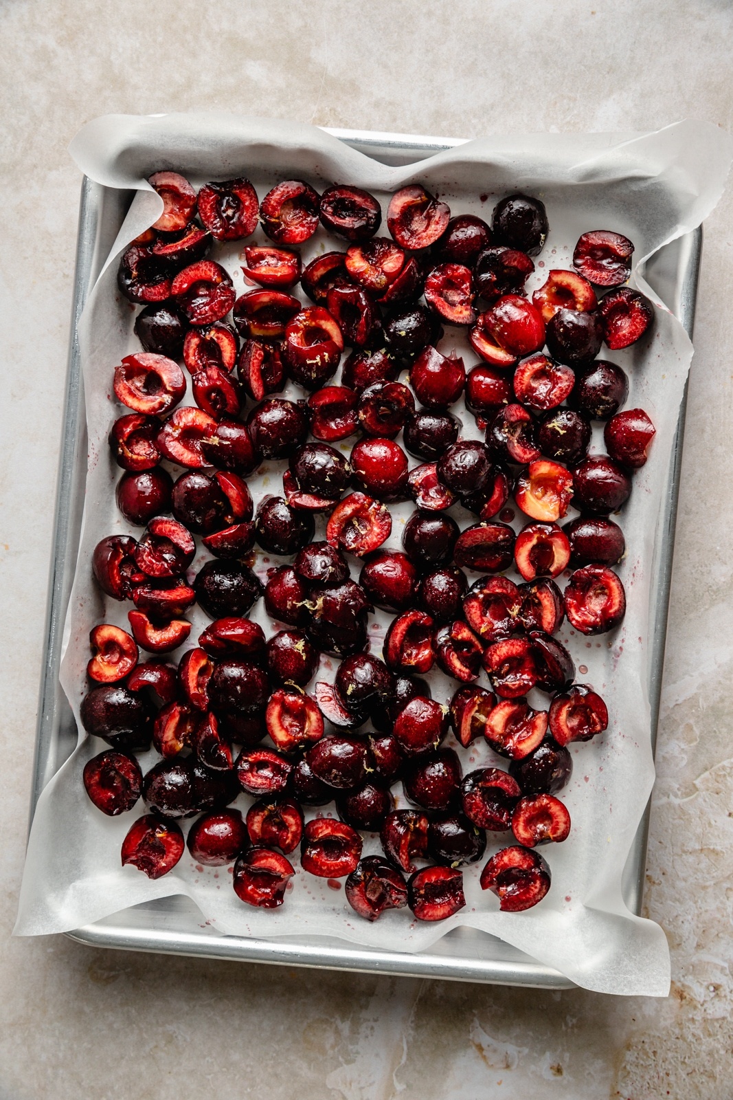 cherries on a baking sheet for roasting