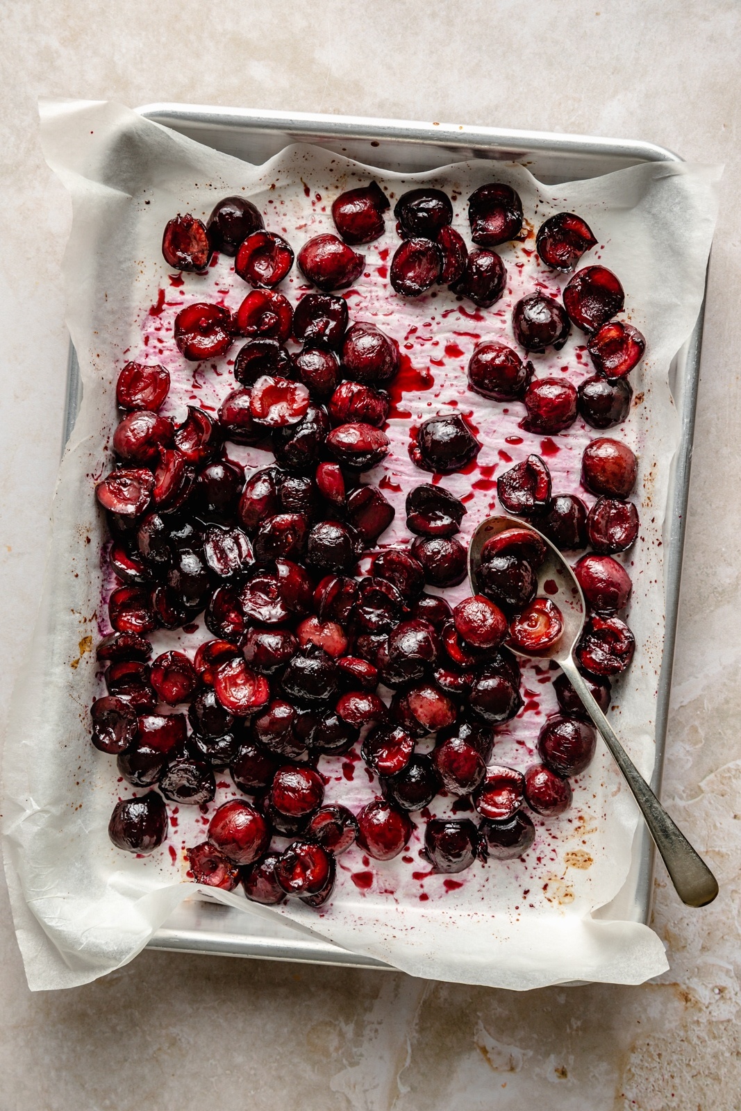 roasted cherries on a baking sheet