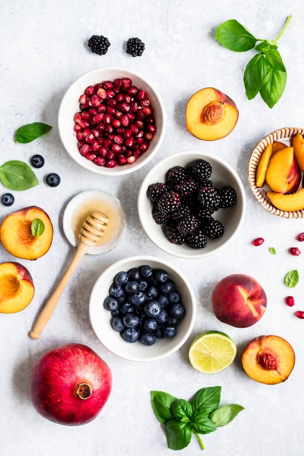 ingredients for peach fruit salad on a surface