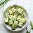 frozen herb cubes in a bowl