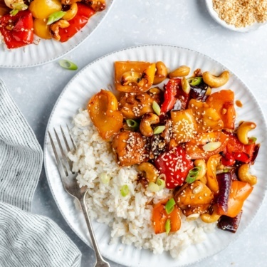 cashew chicken on a plate with rice