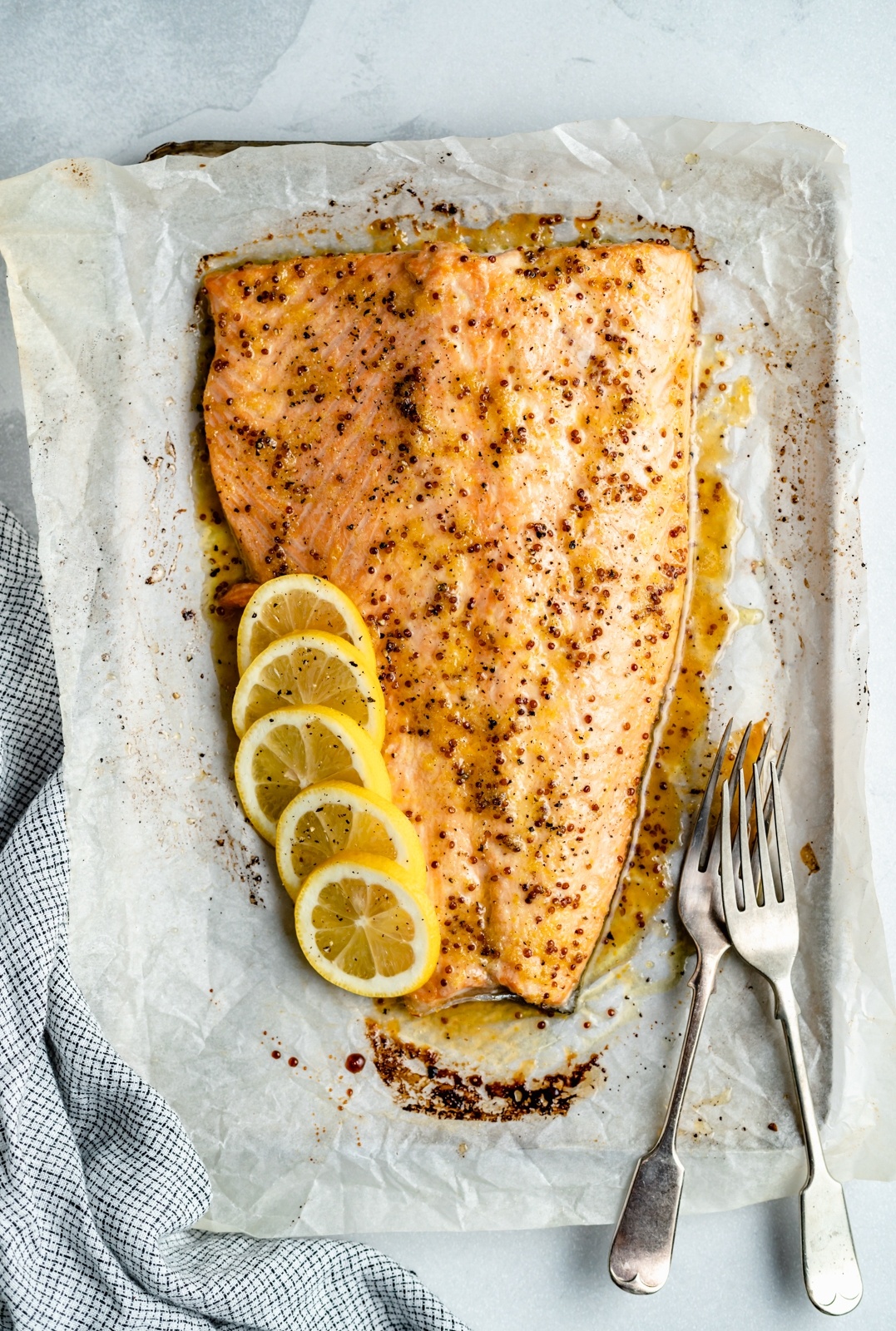 honey lemon garlic salmon on a baking sheet