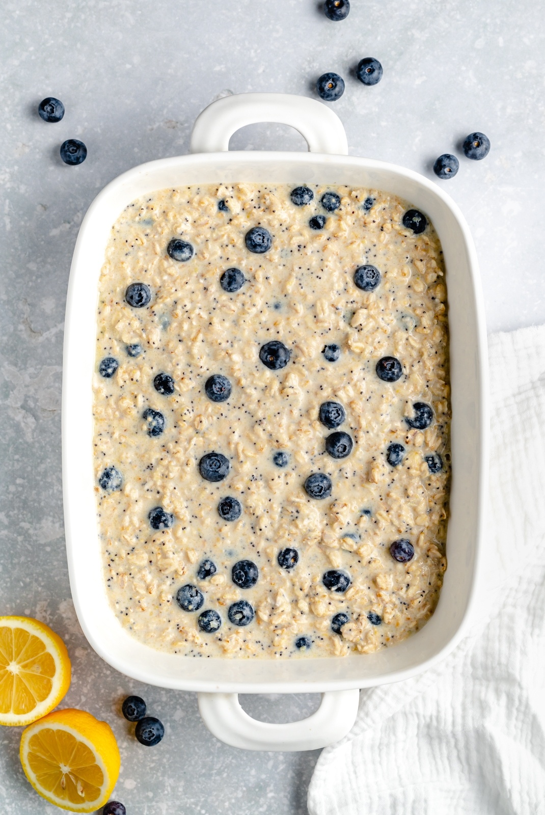 unbaked lemon blueberry baked oatmeal in a baking dish