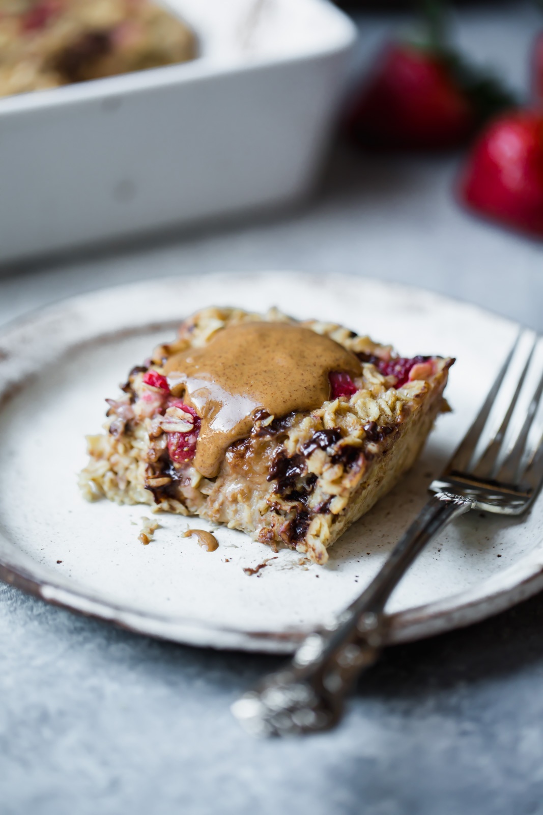 strawberry banana baked oatmeal slice on a plate