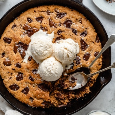 grain free chocolate chunk skillet cookie topped with ice cream