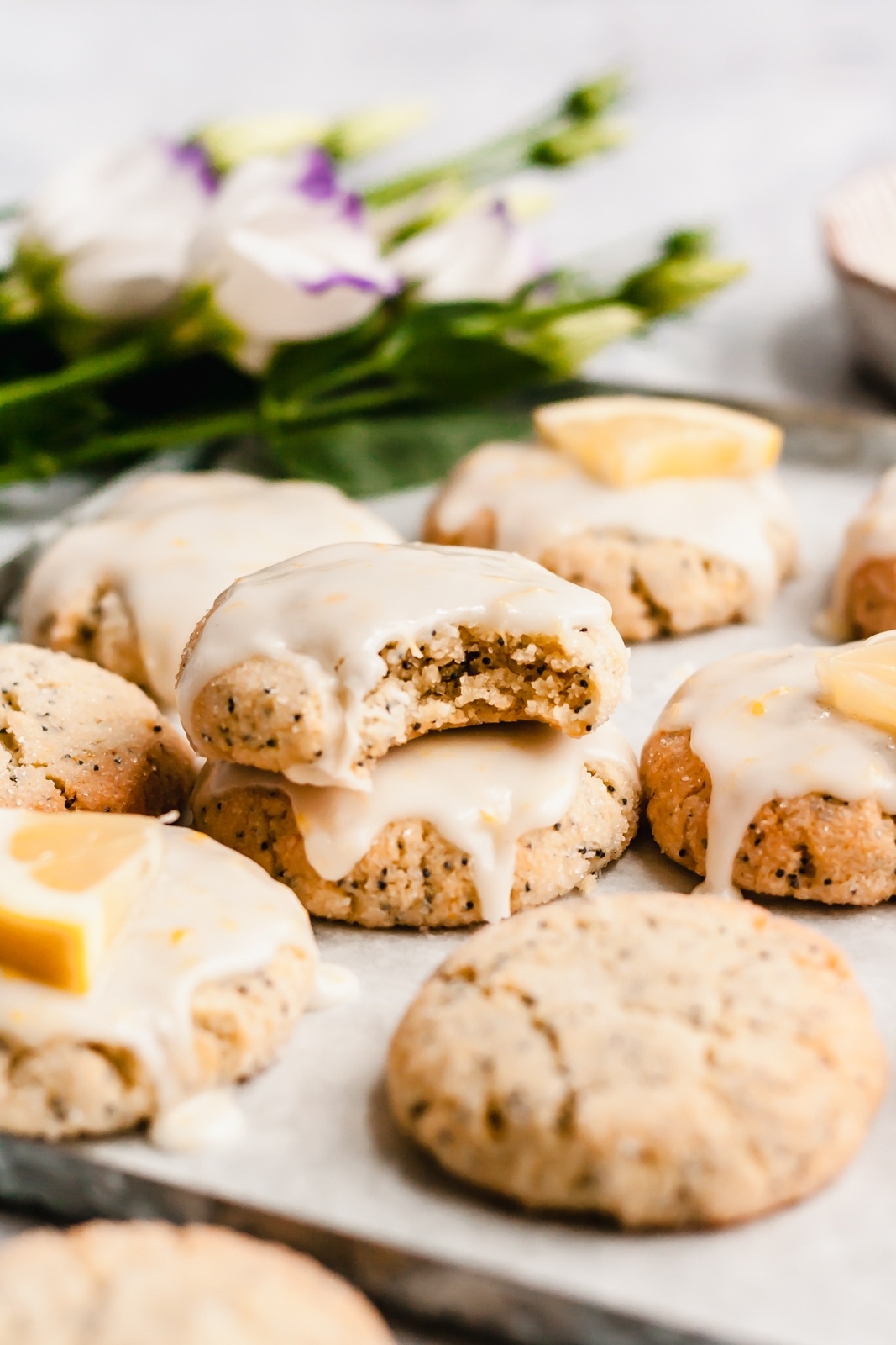 grain free lemon cookies with glaze on a baking sheet