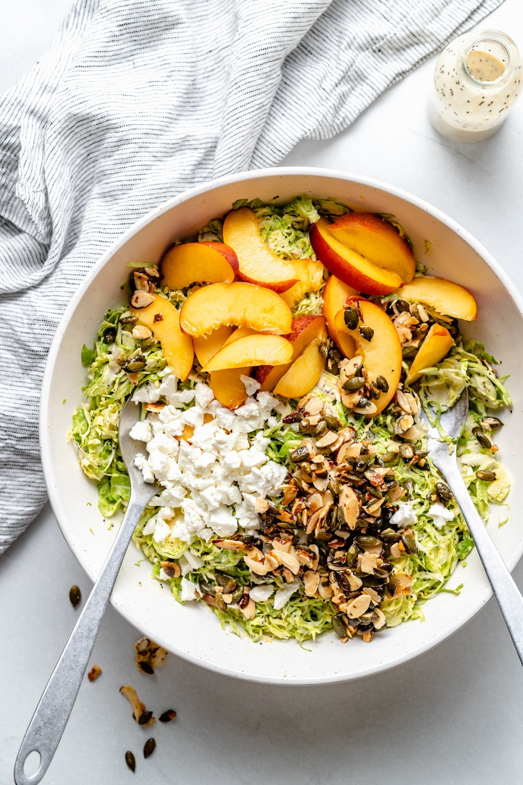 peach brussels sprouts salad in a bowl