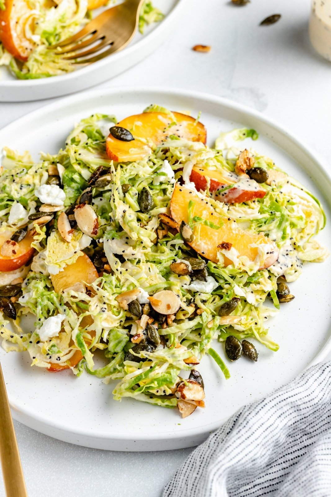 brussels sprouts peach salad on a plate