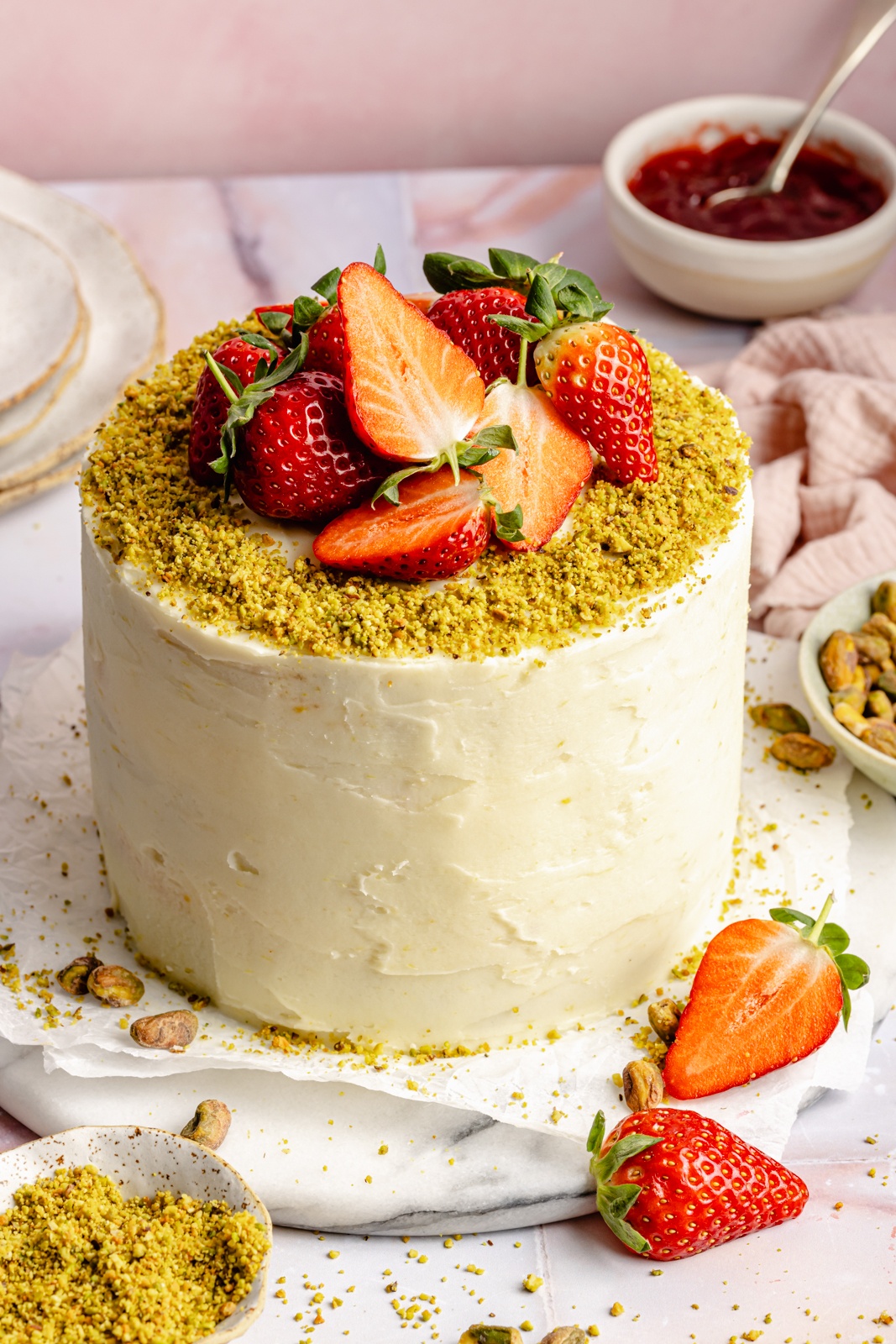 gluten free lemon pistachio cake topped with strawberries