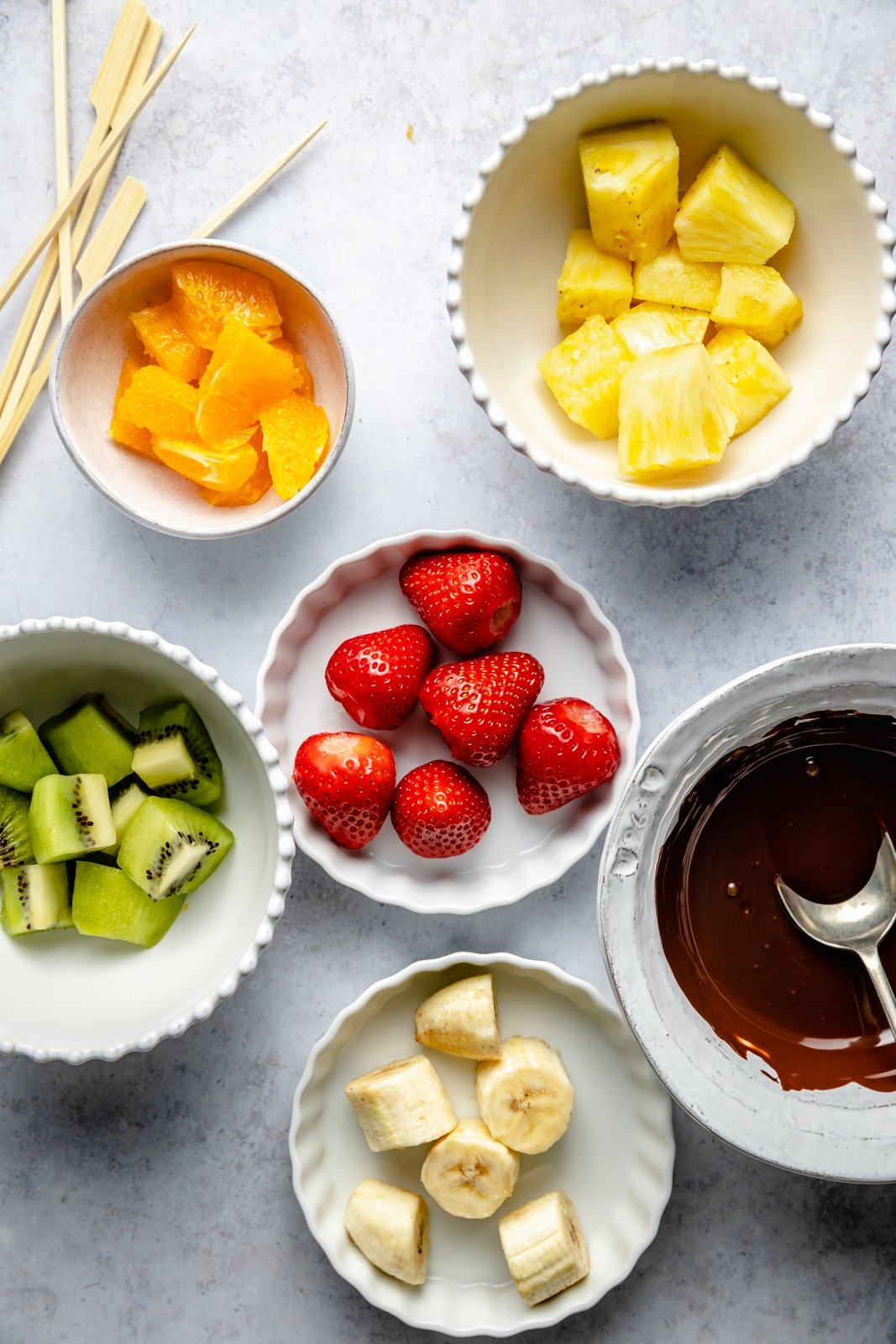 fruit in bowls to make fruit skewers