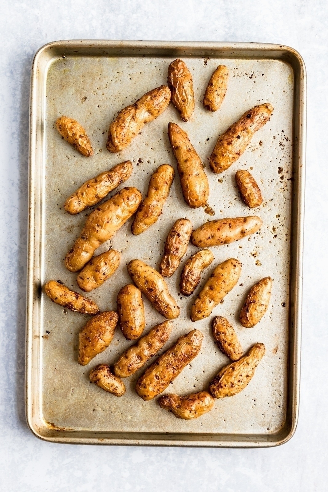 roasted fingerling potatoes on a baking sheet