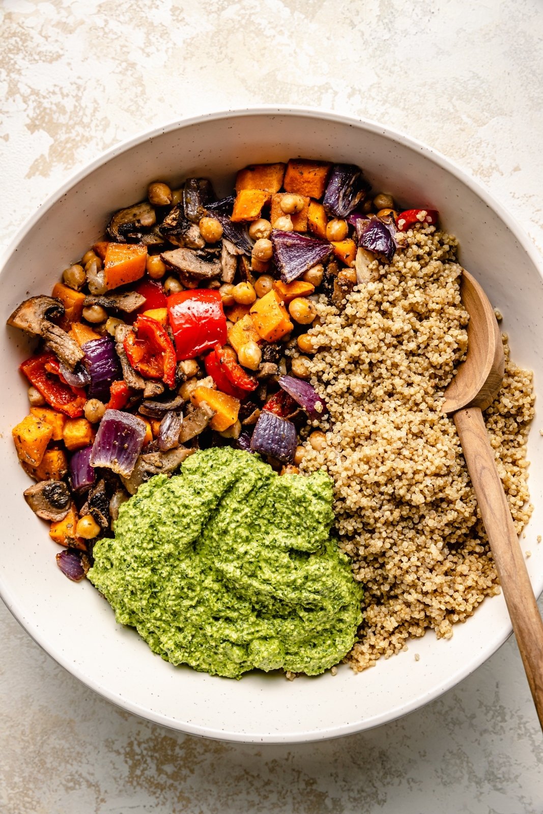 roasted vegetable quinoa salad unmixed in a bowl