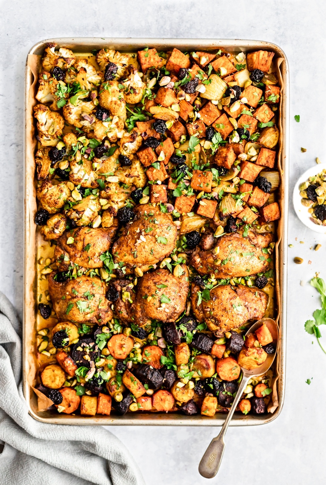 sheet pan Moroccan chicken and veggies on a pan