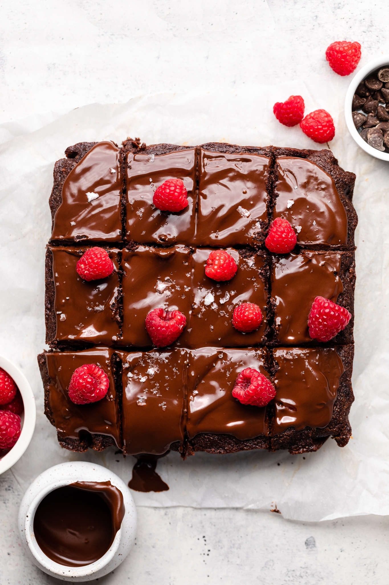 gluten free chocolate zucchini cake topped with raspberries