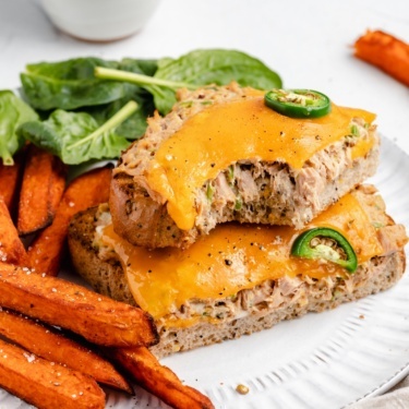 spicy tuna melt on a plate with sweet potato fries