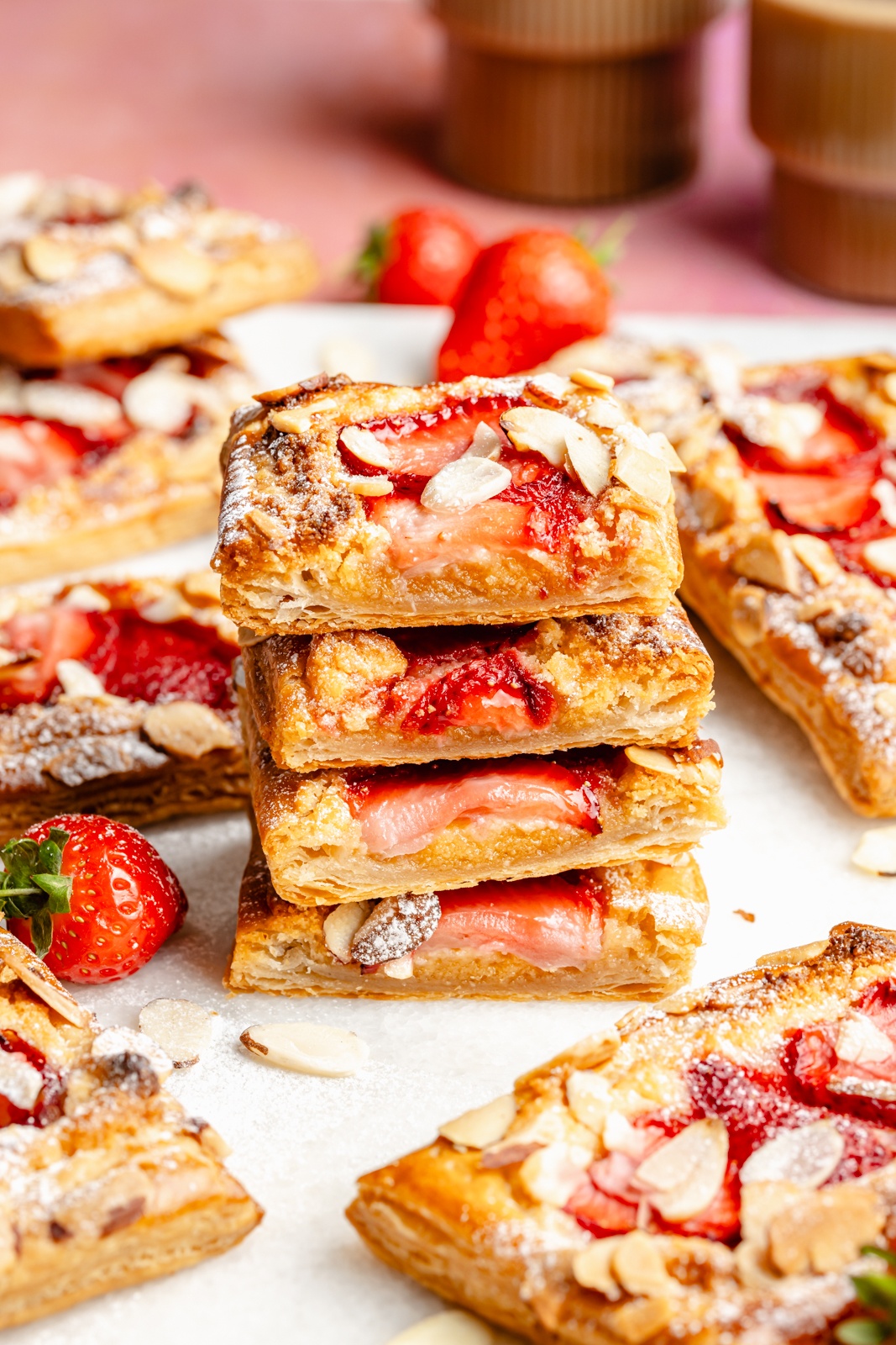 strawberry almond puff pastry tarts in a stack