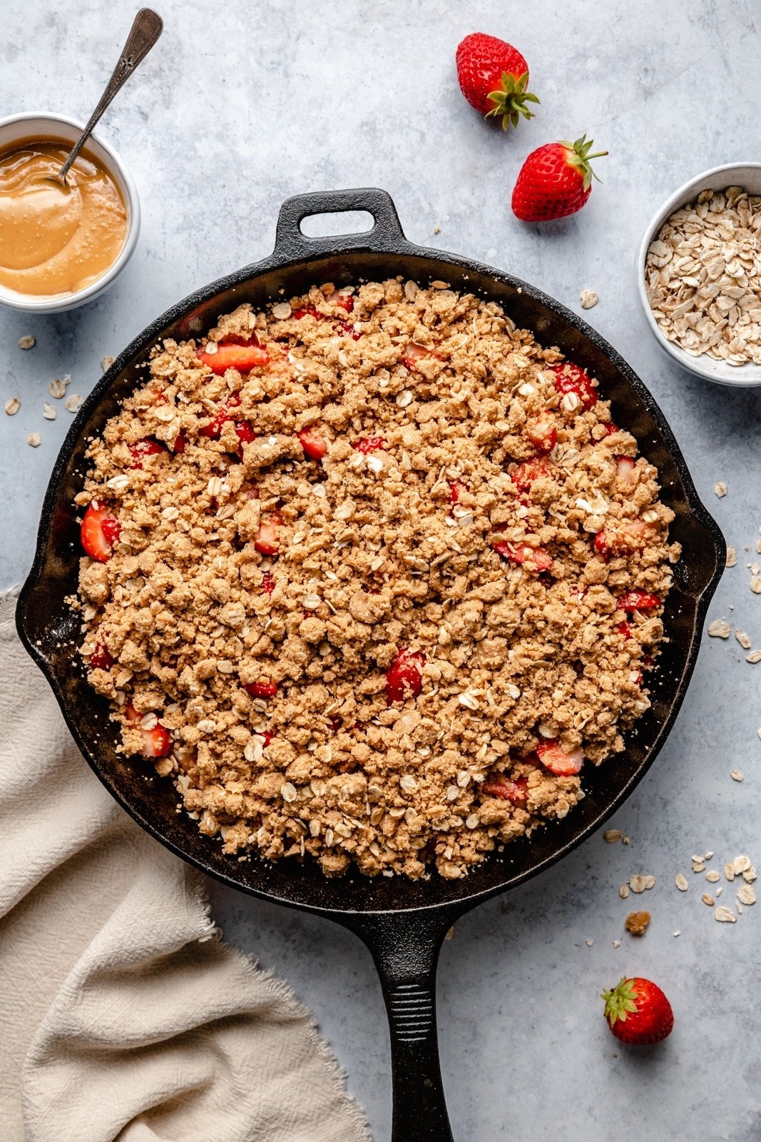 unbaked strawberry crisp in a skillet