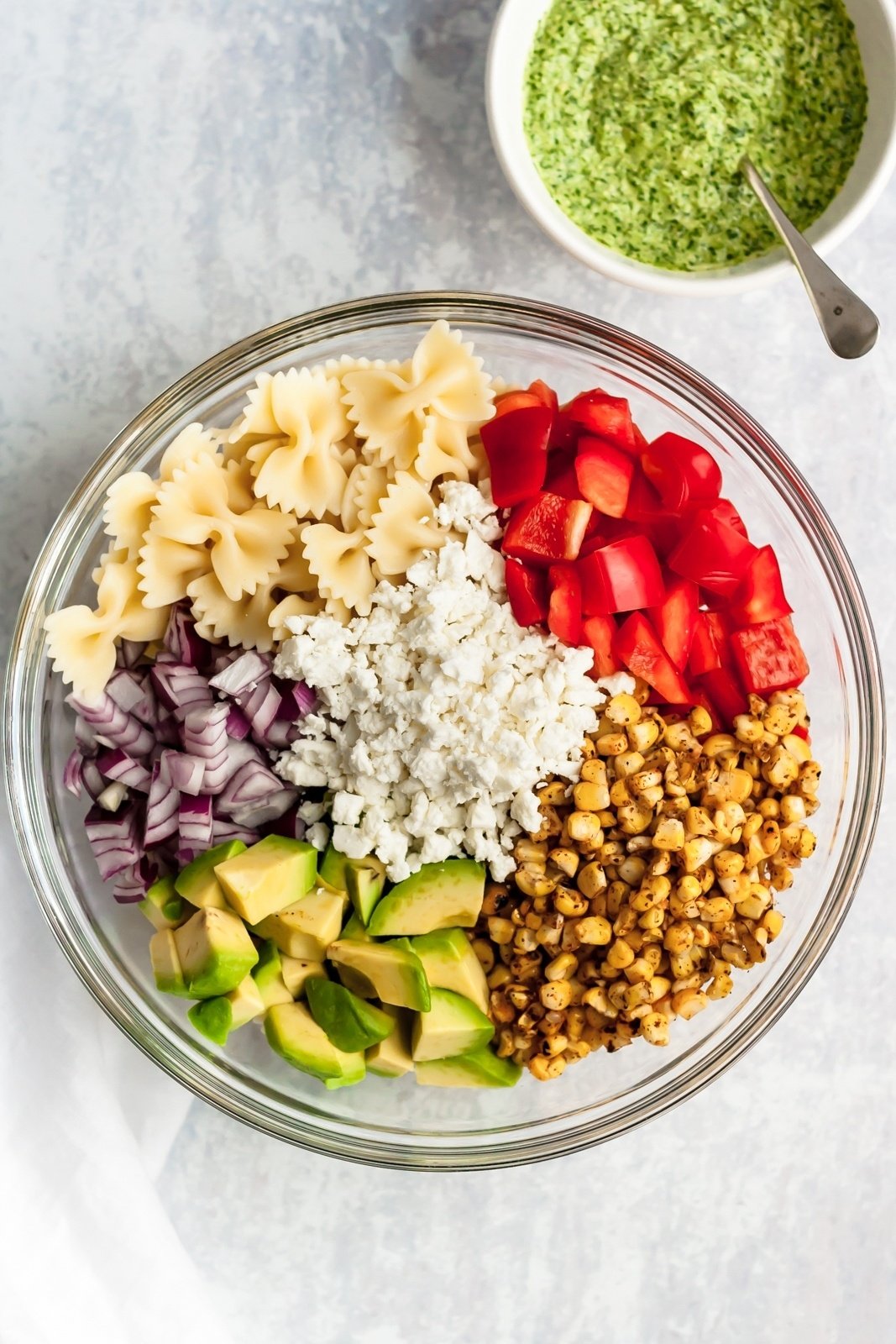 vegetarian street corn pasta salad ingredients in a bowl