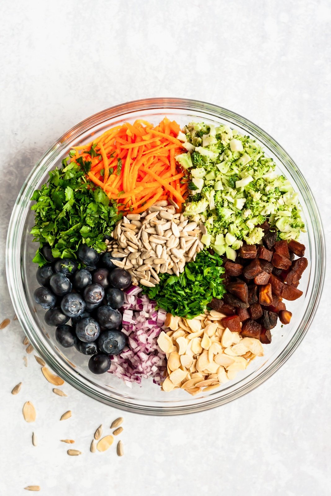 ingredients for a healthy broccoli salad with no mayo in a bowl