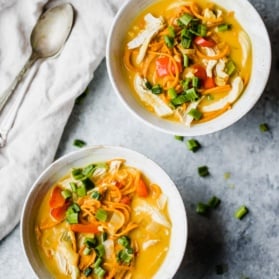 Coconut Chicken Sweet Potato Noodle Soup in two bowls