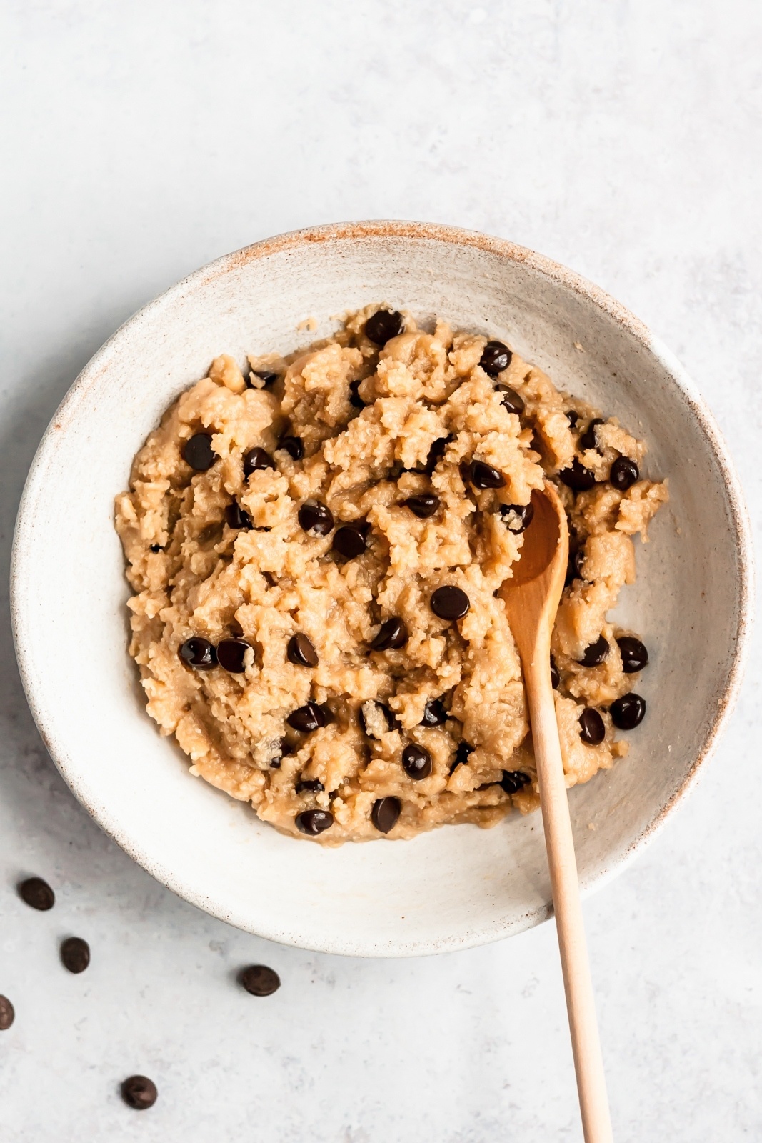 vegan tahini cookie dough in a bowl with a spoon