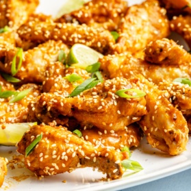 Thai-inspired peanut chicken wings on a platter