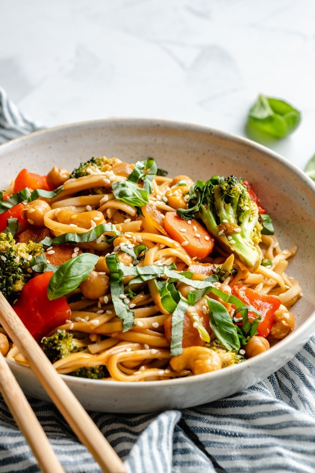 vegan stir fry noodles in a bowl with veggies