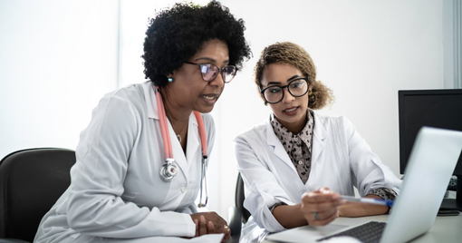 doctors using laptop during conference