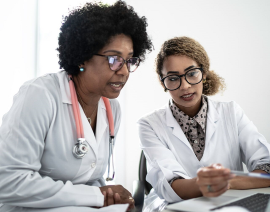doctors using laptop during conference