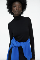 woman in a black turtleneck